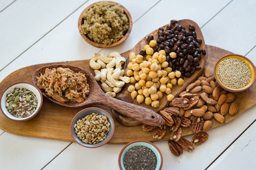 Board with beans, lentils, nuts, and legumes.