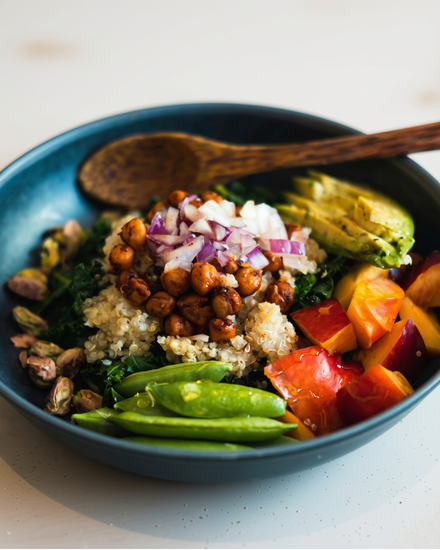 Bowl with chickpeas, avocado, and mixed vegetables.